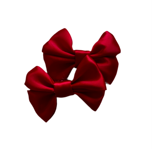 Red bow clip pair